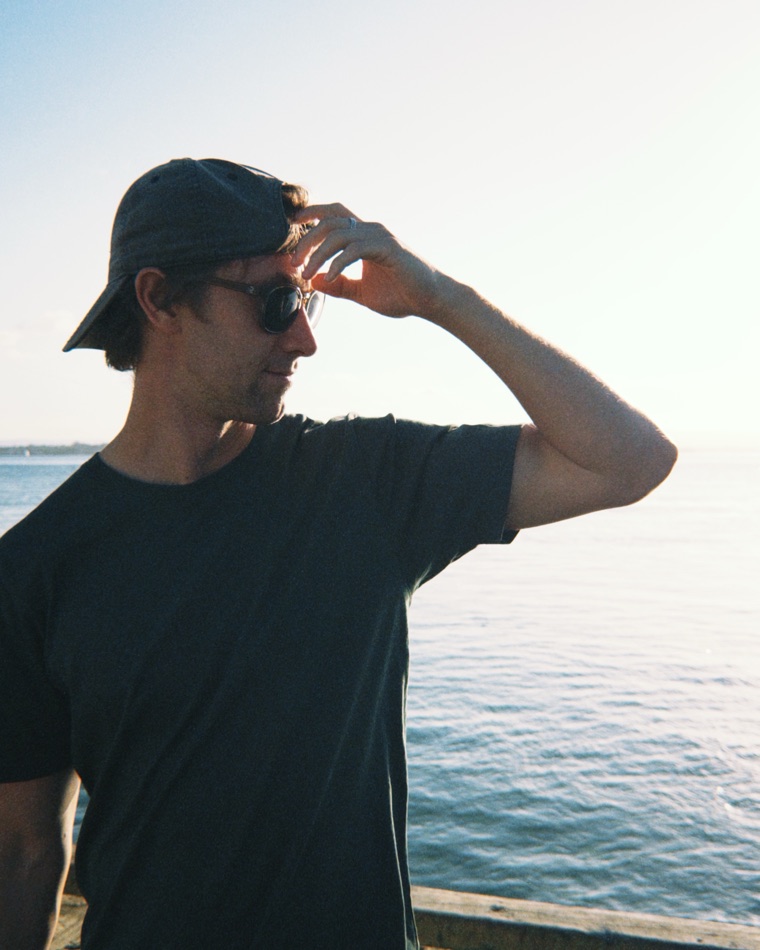 Evan Bryce Riddle outdoors by the coast